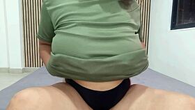 Busty cutie fucks her wet pussy with a toy on the bed.