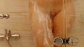 She caresses herself in the bath 😊