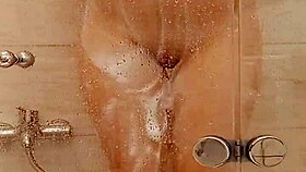 She caresses herself in the bath 😊