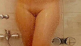 She caresses herself in the bath 😊