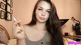 Xo bunny, the brunette Latina with blue eyes, smokes and blows smoke in your face