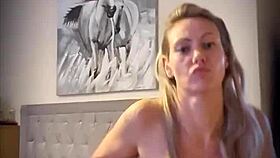 Blonde woman undresses with clothes ripped in teasing striptease