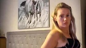 Blonde woman undresses with clothes ripped in teasing striptease