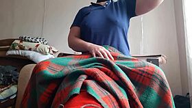 Shy girl licks pussy under blanket