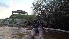 Dark Skinned African Woman Teases Playfully In The Water