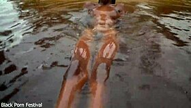 Dark Skinned African Woman Teases Playfully In The Water
