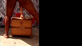 African woman fucks herself outside