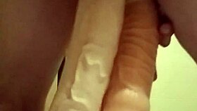 Engaging in detailed self-pleasuring activities with extreme toys and dildos.