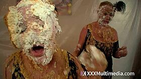 Two blondes get wet and messy while pieing each other in the face