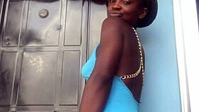 A crazy woman twerks wildly on the balcony under the open sky