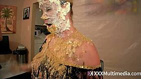 Two blondes get wet and messy while pieing each other in the face