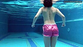 cute shy czech teen swims in pool with shorts