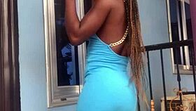 A crazy woman twerks wildly on the balcony under the open sky