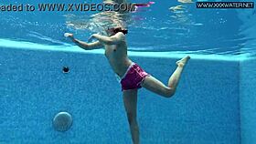cute shy czech teen swims in pool with shorts