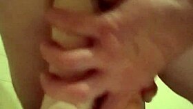 Engaging in detailed self-pleasuring activities with extreme toys and dildos.