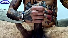 This Brazilian amateur is masturbating his huge oiled balls and big cock in a close-up homemade video