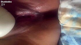 Latina masturbates with vibrator close up