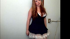 Watch the redheaded tease strip seductively