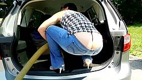 at the car wash, a big ass milf flashes her curves in low rise jeans