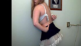 Watch the redheaded tease strip seductively