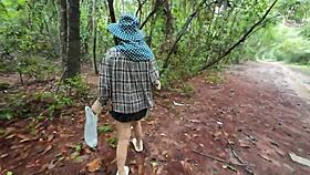 thai girl walks and talks while picking mushrooms in the forest, secretly showing off deep in the woods with clear thai voice