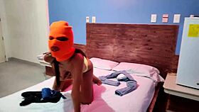 Brunette celebrates Halloween in hotel bed