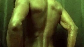 He's stroking his big black cock with loads of oil