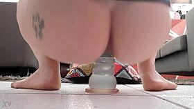 Tattooed bouncing on weird dildo solo