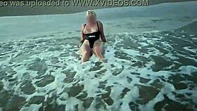 Blonde shows tits and sucks cock on a public beach