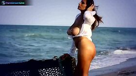 Big tits brunette sensual babe jane masturbates by fingering her pierced pussy on the outdoor beach