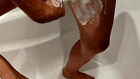 naked woman standing in the shower under the water