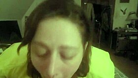 Laying on her stomach and deepthroating the slave's cock