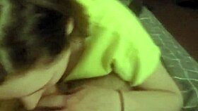 Laying on her stomach and deepthroating the slave's cock