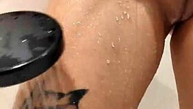 naked woman standing in the shower under the water