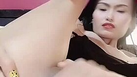 Thaitwentybabe does her fingernails then pleasures her wet pussy