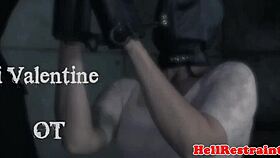 The tattooed participant endures a domination session with clamps.