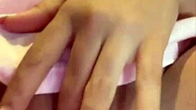 Beautiful Latina teases natural tits while masturbating to climax