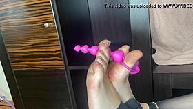 closeup foot in black stockings teases anal bed play