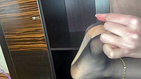 closeup foot in black stockings teases anal bed play