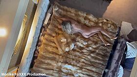 naked monika fox poses seductively on the hotel bed, showing off her big tits and pierced nipples.