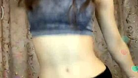 the hot indian model is posing sexily for the camera