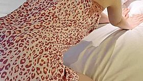 Young woman models flower print camisole, showcasing slender figure and small waist