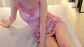 Young woman models flower print camisole, showcasing slender figure and small waist