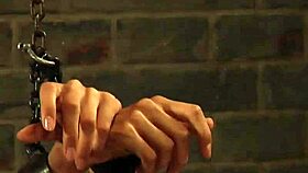 In the dungeon, the submissive slave bends over for hard doggystyle penetration by her mistress.