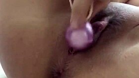 The girl uses chinese balls and vibrator
