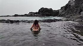 watch the brunette milf practice sucking on the beach