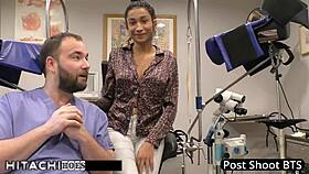 Behind the scenes, nurse Miss Mars teases patient with hitachi vibrator forcing shaved pussy orgasms