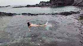 watch the brunette milf practice sucking on the beach