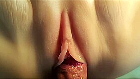 Her white tender pussy in fuck doll with anal double penetration close up.