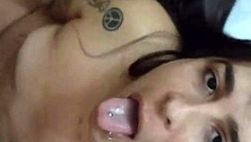 Tattooed crossdresser enjoys a moment with a handsome blonde guy